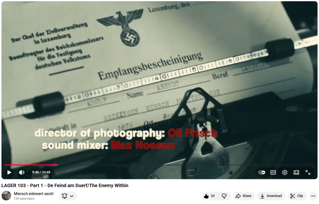 On 7 December 2025, at the Kinoler in Kohlerat 5 p.m. and 6 p.m. and last month on 23 November 2025, the little theatre in Mersch was packed. More than two hundred people came to watch the premiere of a 35-minute film that, through its restraint and raw power, left the audience stunned into silence: Lager 103 – Part 1: De Feind am Duerf (The Enemy in the Village).